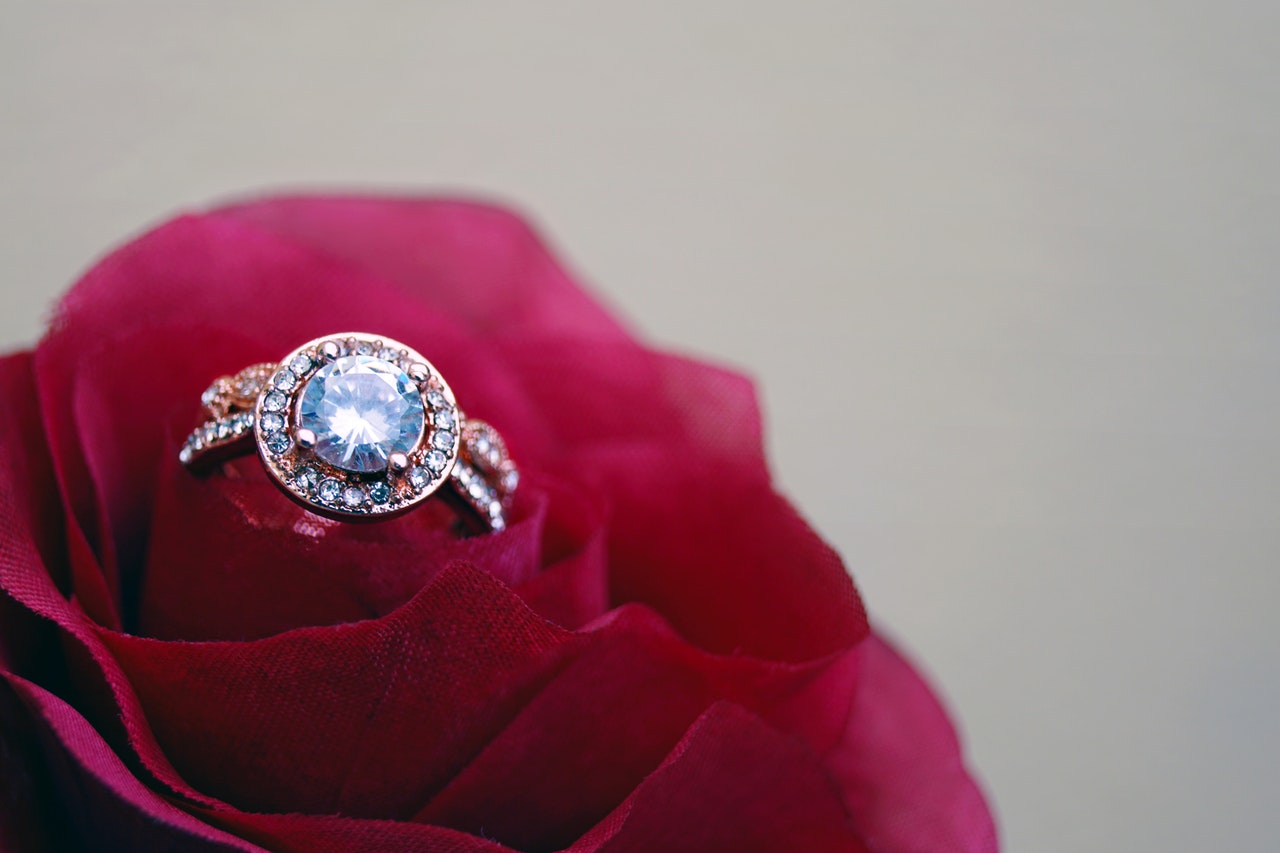 a propousal ring on a rose
